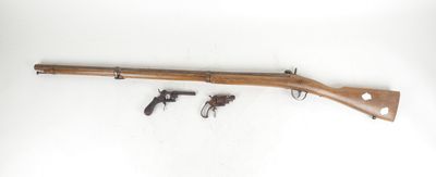 an old wooden rifle with two revolvers on a white background