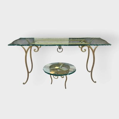 an image of a table with a glass top and metal legs