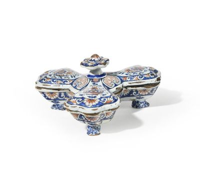 a blue and white porcelain box with a bird on top