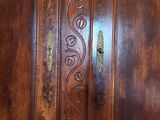 a wooden door with a carved design on it