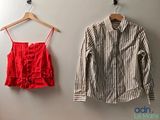two shirts hanging on the wall next to each other