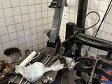 a machine that is sitting in a room with a lot of tools