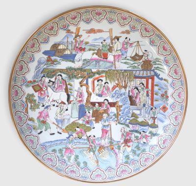 a plate with a painting on it on the wall