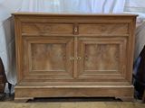 a wooden cabinet with two doors on top of it