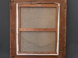 an old wooden frame with a picture hanging on the wall