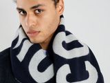 a picture of a young man wearing a scarf and jacket