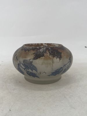 a blue and white bowl sitting on a white surface