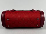 guccissi red leather cylinder bag with studded handles