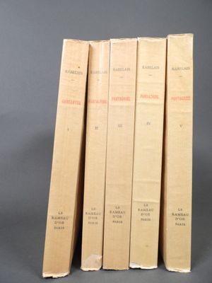three books are stacked on top of each other on a gray surface