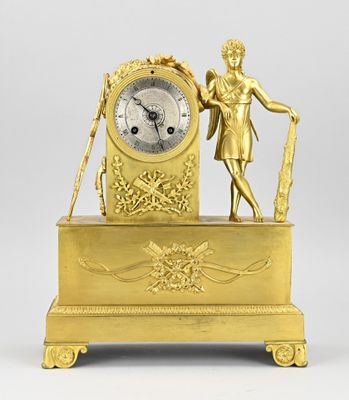 an image of a gold clock with a statue on top of it