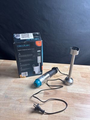 a box and a cord connected to a microphone on a table