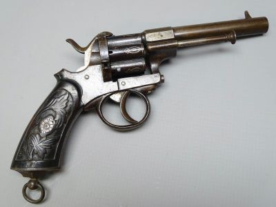 a gun that is sitting on top of a table