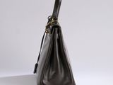 a brown leather handbag on a white background