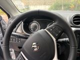 a steering wheel and dashboard of a car in a car