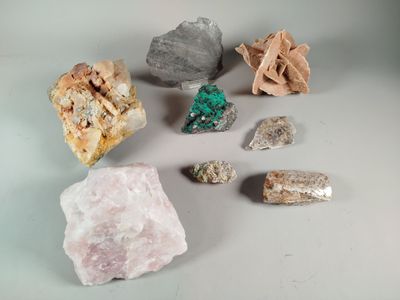 several different types of rocks and stones on a white surface