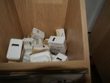 a wooden box filled with electronic devices and other items