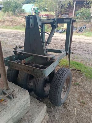 a forklift that is sitting in the dirt