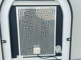 an image of a clock with a maze design on it