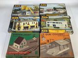 four boxed boxed boxed model trains on display on a white surface