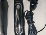 an image of a hair clipper and a charger on a table