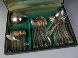 a box with silverware in it on a table