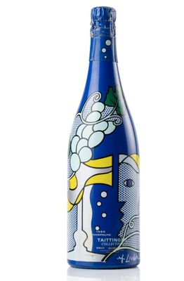 a bottle of blue and white wine sitting on top of a table