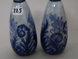 two blue and white vases with numbers on them