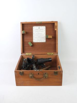 a wooden box with a bunch of hair dryers inside of it