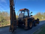 a tractor that is parked on the side of the road