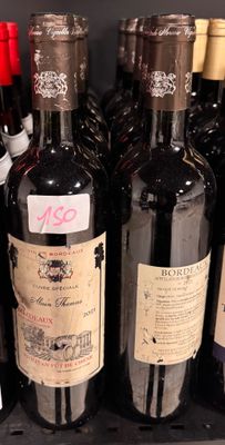 several bottles of wine are lined up on a shelf in a store