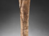 a close up of a wooden stick on a black surface