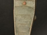 a close up of a metal object on a black background
