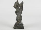 an image of a statue of a woman holding her hands up