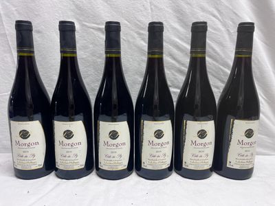six bottles of wine are lined up in a row on a table