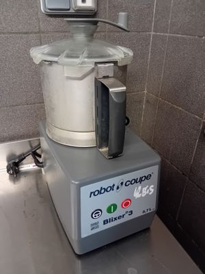 a blender sitting on top of a counter in a kitchen