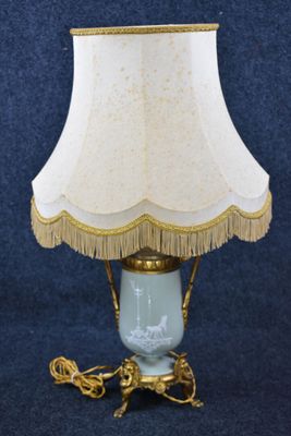 a lamp that has a white shade on it