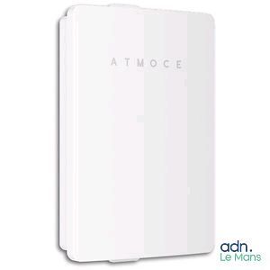a white wall mounted device with the word atmocce on it