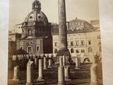 a picture of an old photo of a building with a clock tower