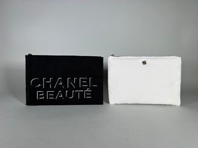 two black and white purses with chanel beauty written on them