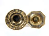 pair of antique brass candlesticks on a white background