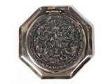 an image of a silver plate with a design on it