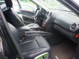 the interior of a car with black leather seats and a steering wheel