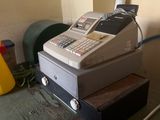 a cash register sitting on top of a table