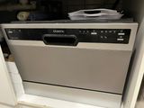 a dishwasher that is sitting in a cabinet