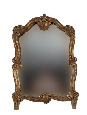 an image of a mirror with a gold frame on a white background