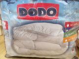 a bag of bedding sitting on a table in a store