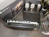 a picture of a video game system with a controller and a keyboard
