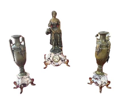 four different sized vases sitting on top of a table next to each other