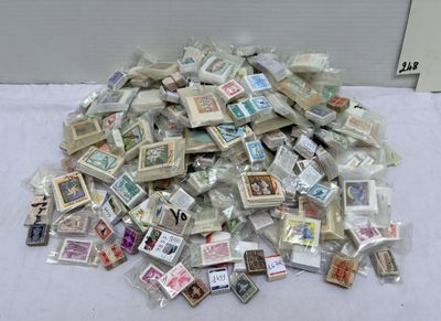 a pile of stamps sitting on top of a table