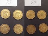 Plusieurs types de pièces d'or sont représentés sur un fond noir